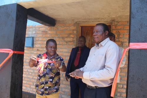 Magomero (left) and Golowa cutting the ribbon to mark official opening of the hostel