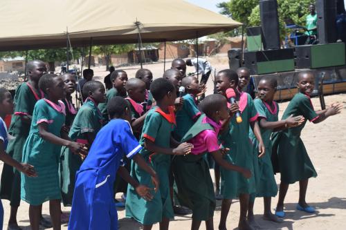 Kasuza lerners making an appreciation performance during the handover ceremony