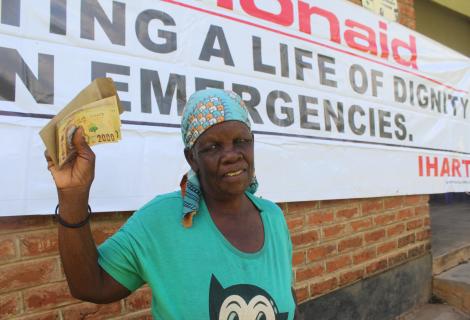 Liginet Nakhozo after receiving cash support during the ActionAid Malawi disaster response in Phalombe