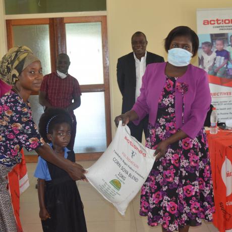 ActionAid Malawi Vice Board Chairperson, Professor Dorothy Nampota (right) making a symbolic presentation of the donation to ECD centre