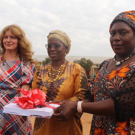 7. Haedel, left presenting a CBCC catalogue to Mamhumula flanked by ActionAid Malawi Board Chairperson, right , Professor Dorothy Nampota