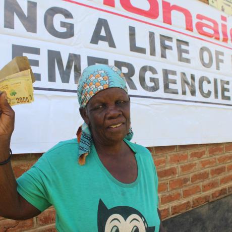 Liginet Nakhozo after receiving cash support during the ActionAid Malawi disaster response in Phalombe