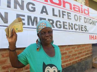Liginet Nakhozo after receiving cash support during the ActionAid Malawi disaster response in Phalombe
