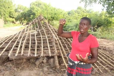 Esnert Thaison explaining how the floods destroyed her house