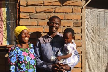Life of hope: Kandulu's family at the house they are constructing