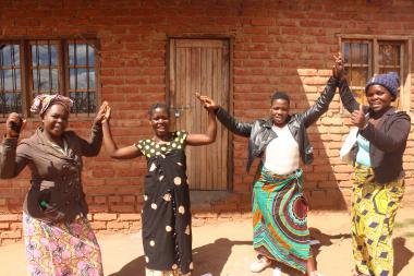 Lifing each other econoimically: Tilimbike Project Facilitator for Dedza, Pamela Likoswe (2nd Right) and members of Maziko VSLA during a monitoring visit 