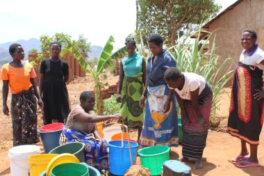 Chimswera communities drawing water from the tap